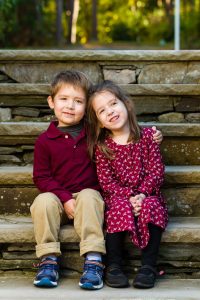 Young brother and sister sitting on stone steps, children's portrait at a client's home in Northborough, MA