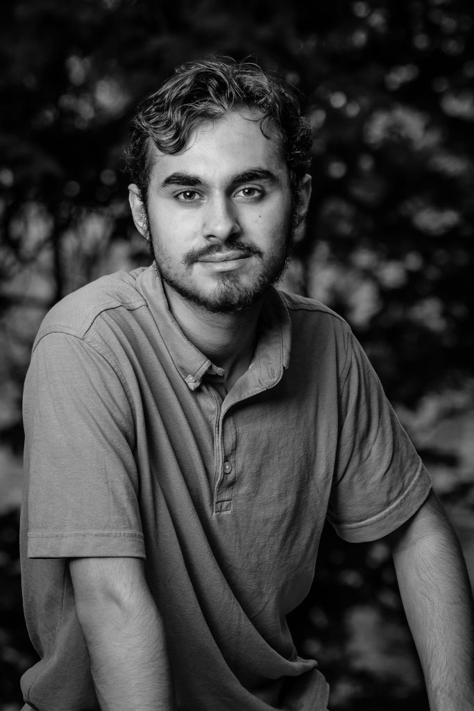 Black-and-white senior portrait of a young man in a polo shirt, Dean Park, Shrewsbury, MA